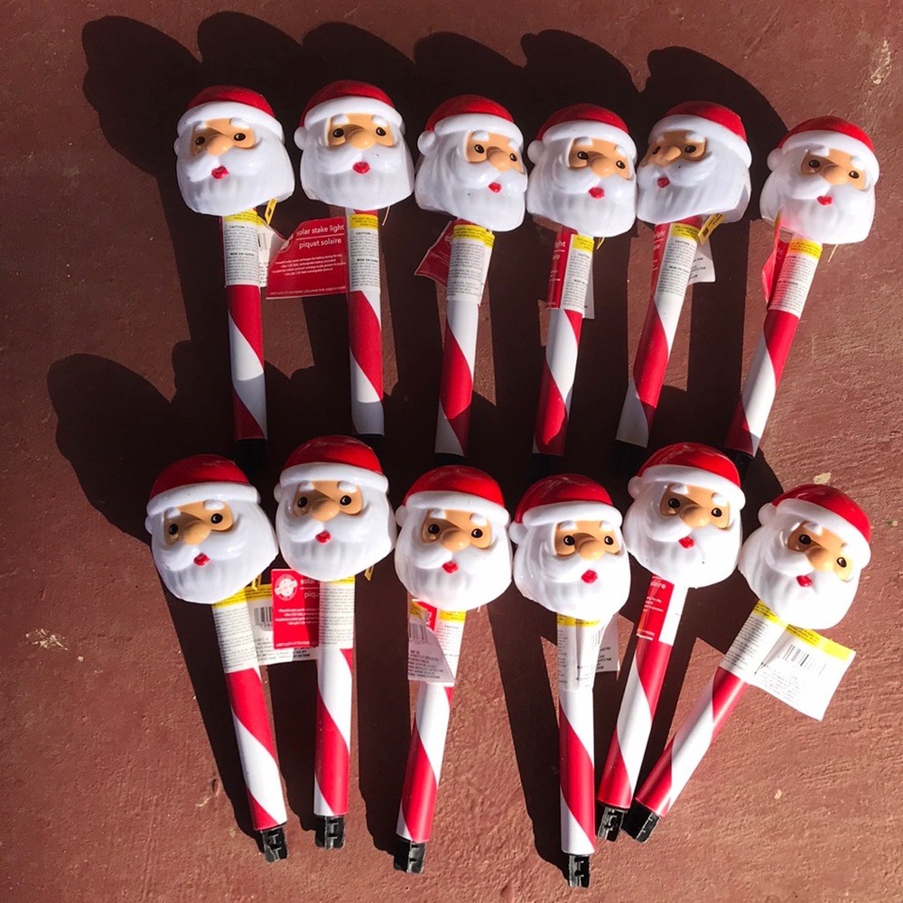 New set of 12 Santa Claus solar yard stake lights